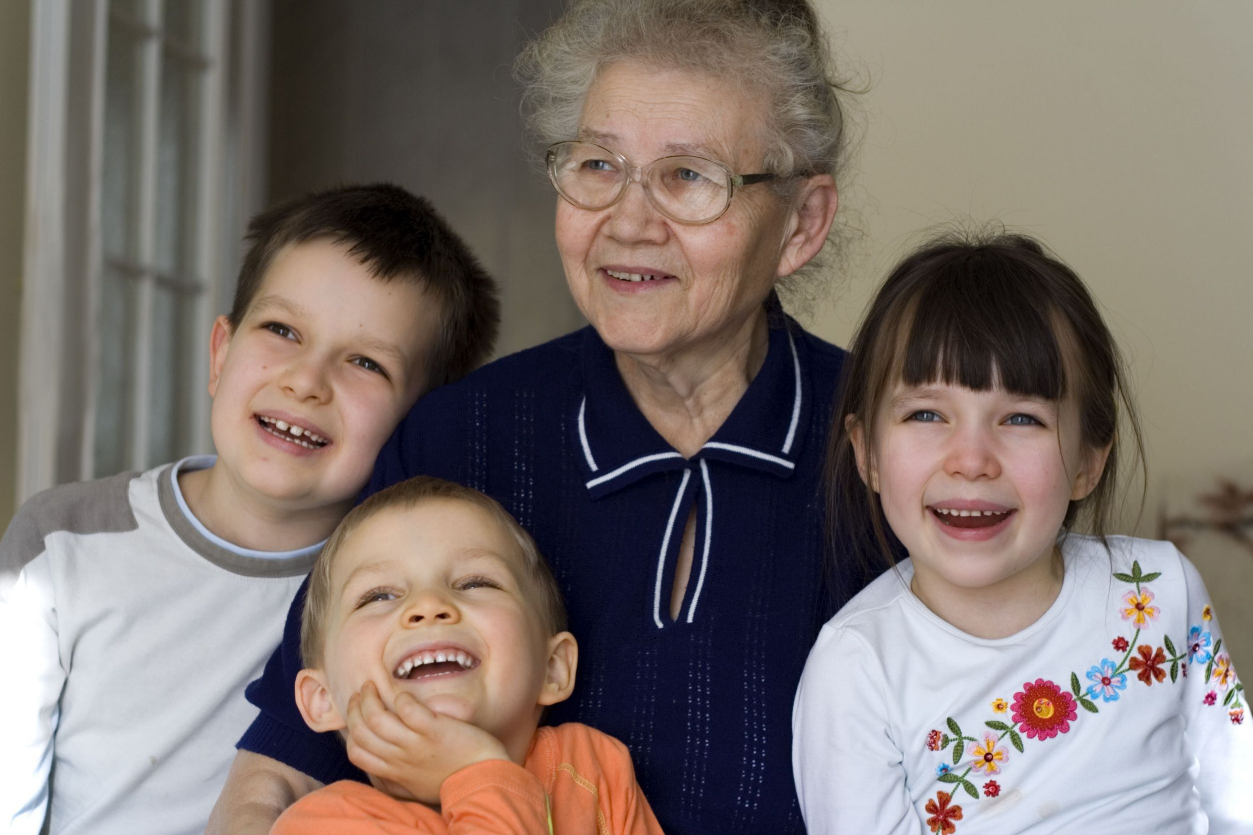 Grandmother with grandchildren laughing